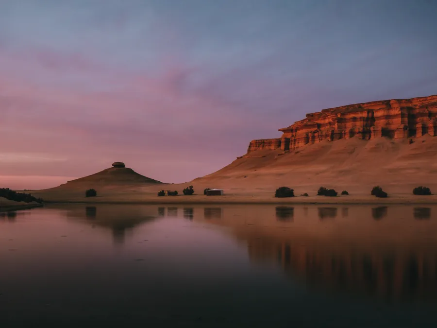 Cliffs reflected in a Fayoum lake at dusk