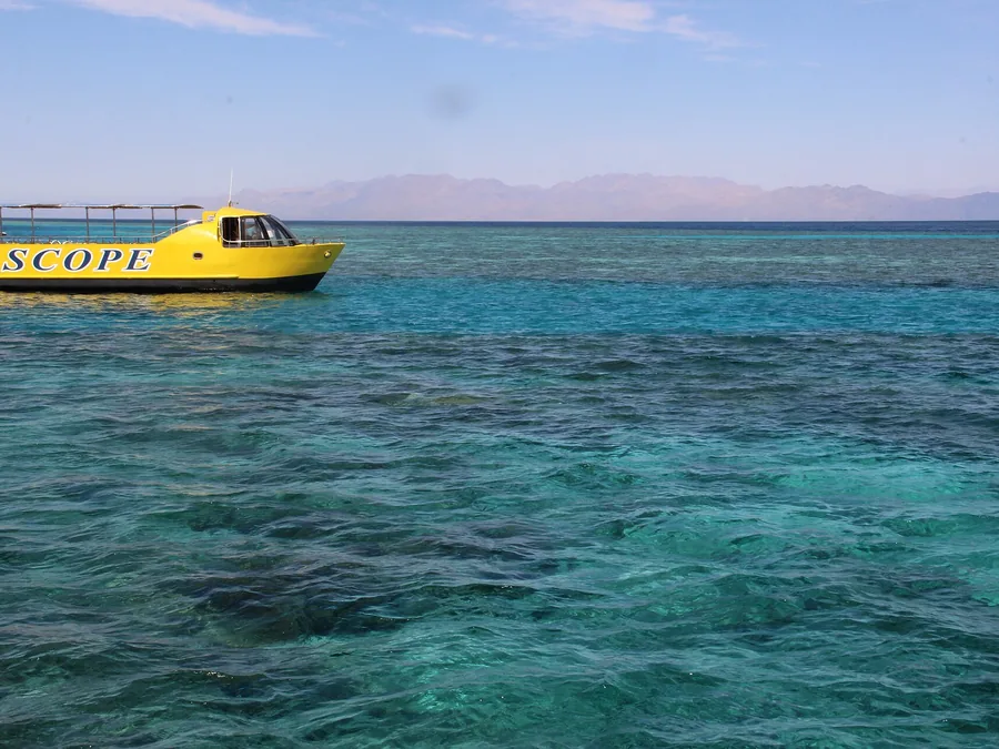 Snorkelling boat anchored over a reef in the Red Sea